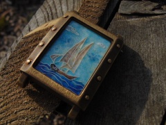 "Omega" - tarcza z emalii na srebrze.