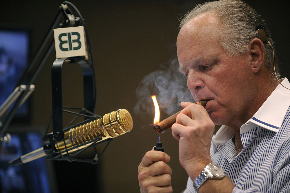 Rush-Limbaugh-smokes-a-cigar-in-his-radio-broadcast-booth.thumb.jpg.140a493f2b2be4acefb6148d89589062.jpg